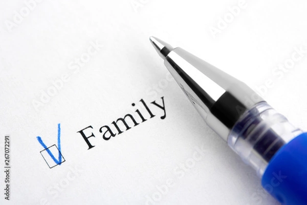 Fototapeta Family. Filling in the questionnaire, documents. The checkboxes are filled with a black pen on a white background. Questionnaire, survey.