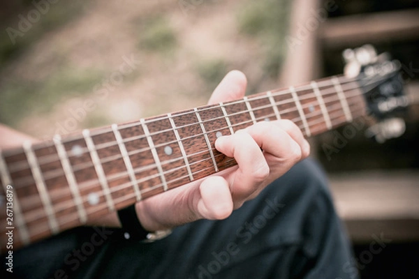 Fototapeta The technique of playing the electric guitar - bands - heavy hard rock and blues music