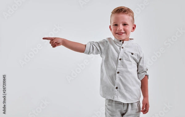Obraz Little boy on gray background