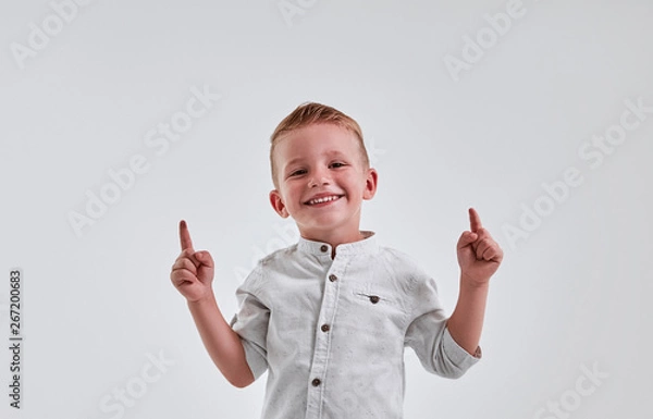 Obraz Little boy on gray background