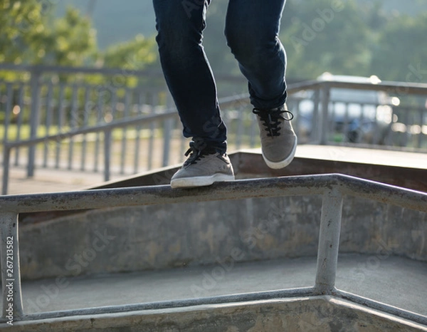 Obraz parkour jumping on steel pipe with balance