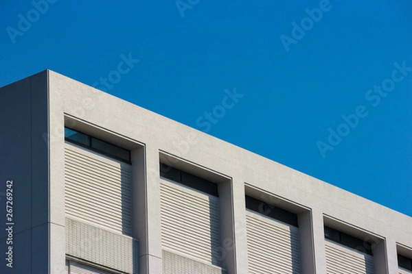 Obraz High building part with blue sky background.