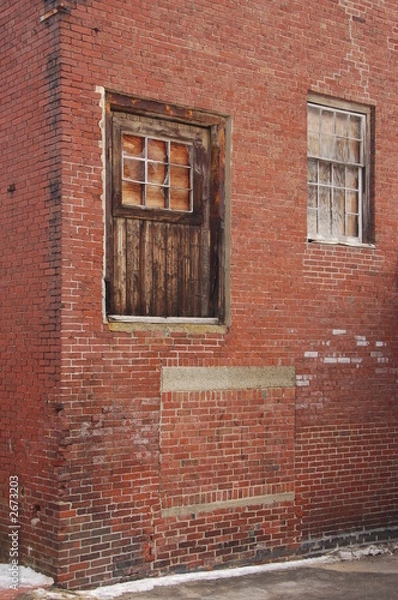 Obraz old windows on a brick building
