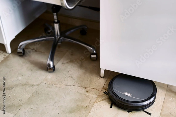 Fototapeta robotic vacuum cleaner on the floor