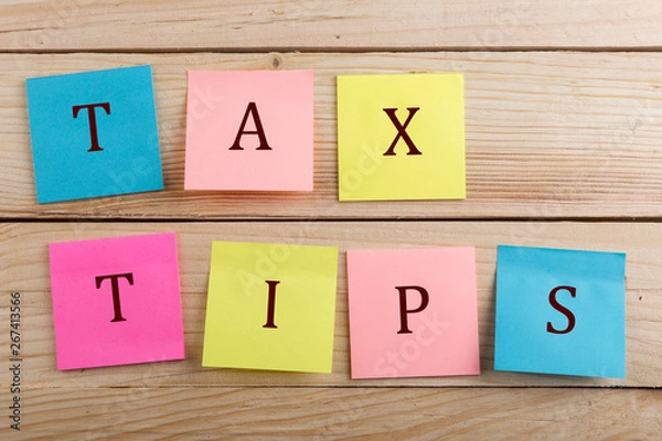 Fototapeta Business concept for taxpayer - Many colorful sticky note with text Tax tips