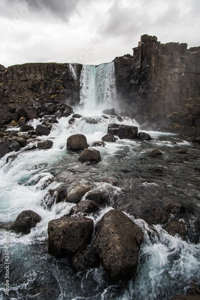 Obraz waterfall and rocks in the river
