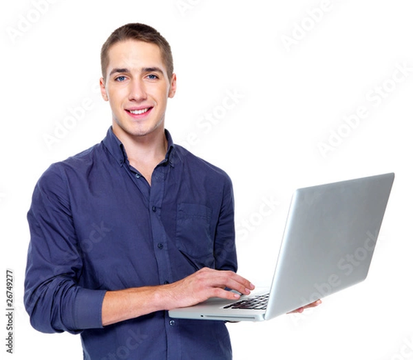 Fototapeta Handsome man with laptop isolated on white