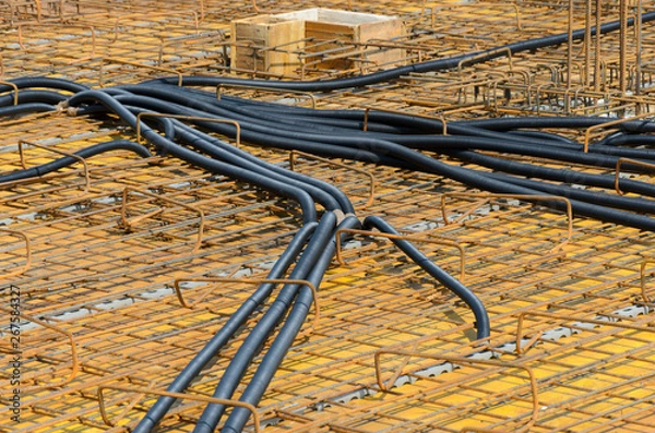 Obraz Pipes for electrical network located on construction site