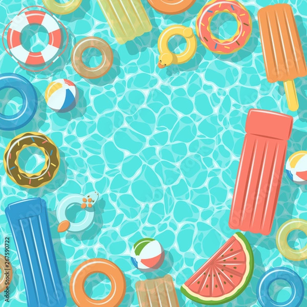 Fototapeta Swimming pool from top view with colorful inflatable rubber rings, rafts, beach ball and life buoy