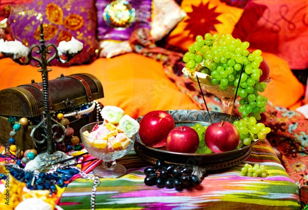 Obraz Oriental style with fruit, candy and box