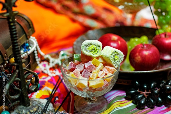 Obraz Oriental style with fruit, candy and box