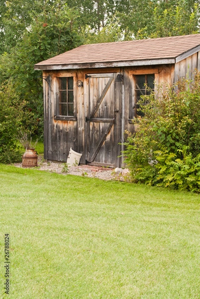 Fototapeta A charming, rustic garden shed made from reclaimed timber