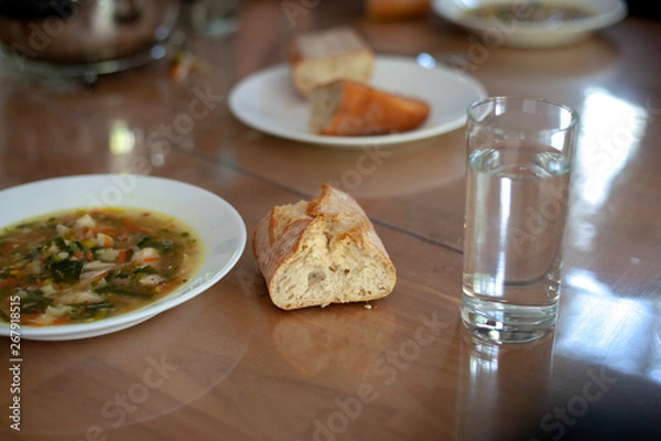 Fototapeta soup with bread and water
