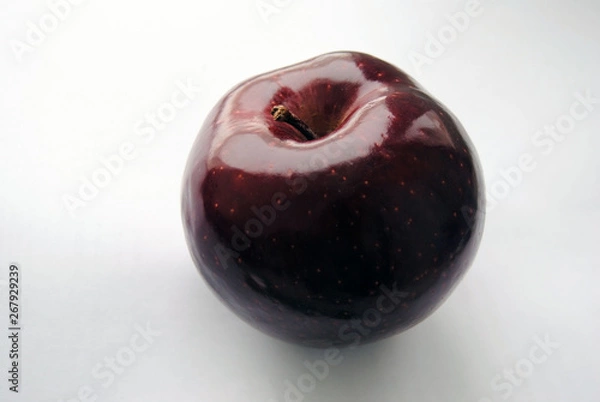 Obraz dark red apple on a white background