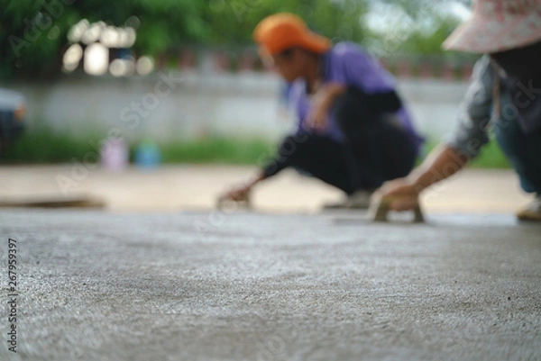 Fototapeta Asian worker labor working with concrete cement floor