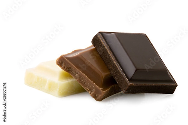 Fototapeta Dark, milk and white chocolate squares isolated on white. Rough edges.