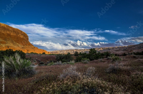 Fototapeta A late in the day shot of clouds gathering over the Waterpocket Fold in Capitol Reef National Park.
