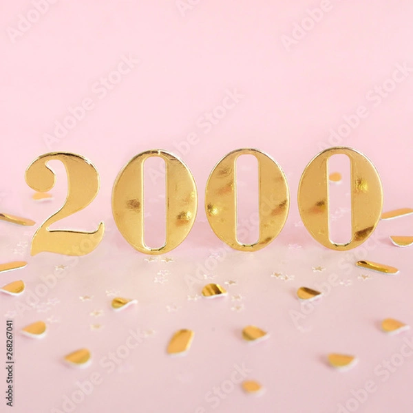 Obraz The number 2000 in golden numbers on a pink background and golden confetti. Space for text...
