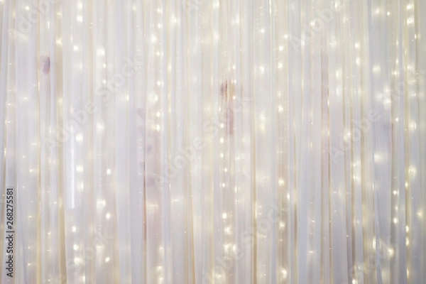 Fototapeta White curtain backdrop with small LED lights decoration