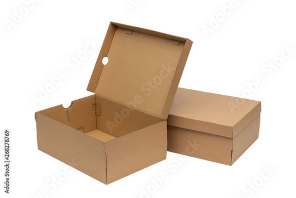 Fototapeta Brown cardboard shoes box with lid for shoe or sneaker product packaging mockup, isolated on white with clipping path.