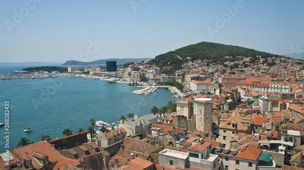 Fototapeta Aerial view of coast and roofs from the bell tower, beautiful cityscape, sunny day, Croatia Adriatic sea, Split, Croatia