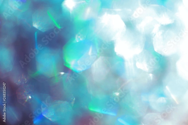 Fototapeta Blur background. Silver and blue sequins. bokeh