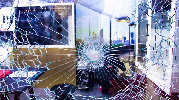 Fototapeta Bulletproof glass for home and office wall. Bullet resistant glass. House material for safety and protection. Anti Thief, resistant to penetration curtain wall.  Concept image for crime investigation.