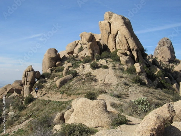Fototapeta View of a trail with hikers on the path to Tom's Thumb in the McDowell Mountains in the Sonoran desert near Scottsdale, Arizona 