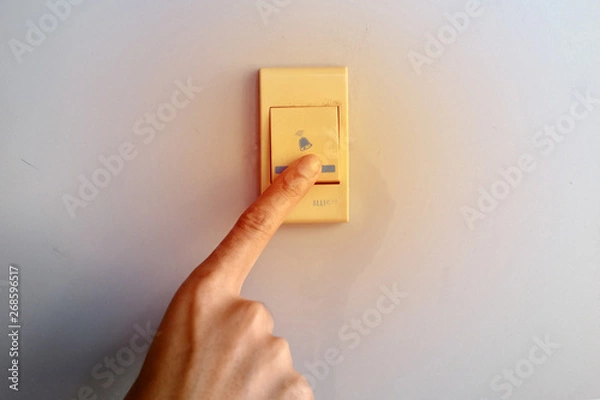 Obraz Humans Pressing the bell with selective focus.