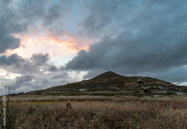 Obraz Tick clouds masking the colourful sunset