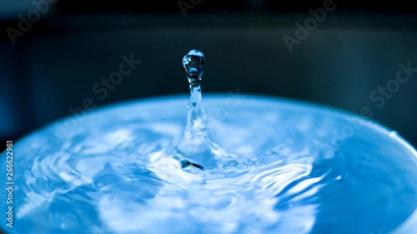 Fototapeta falling drop into clear water