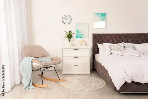 Fototapeta Modern bedroom interior with comfortable chair. Stylish design