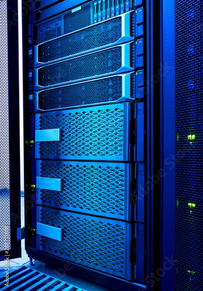 Obraz Computer server and raid storage in datacenter cold blue toning