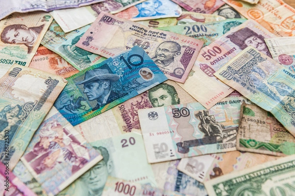 Obraz Perspective of blue money bill on other banknotes