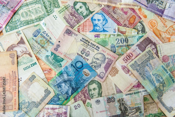 Obraz Colorful background made of used international money bills