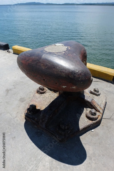 Obraz Rusty mooring bollard with ship ropes