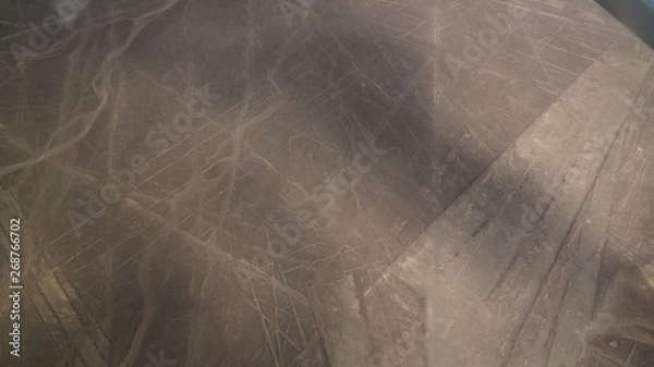 Fototapeta Aerial airplane panoramic view to Nazca geoglyph lines aka frigate bird and heron or flamingo , Ica, Peru