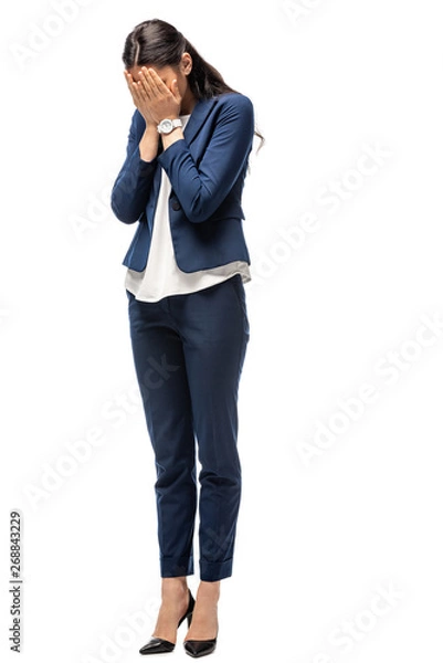 Obraz sad businesswoman in suit covering face and crying Isolated On White