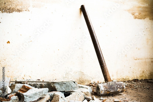 Fototapeta A hammer used to demolish the concrete tile floor and wall of the house before renovation. It heavy and very hard because it made from metal.