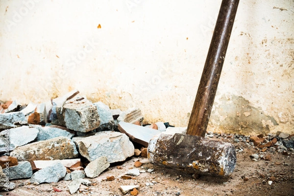 Fototapeta A hammer used to demolish the concrete tile floor and wall of the house before renovation. It heavy and very hard because it made from metal.