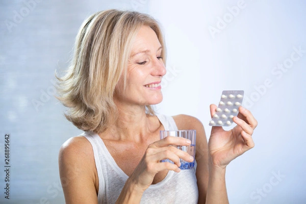 Fototapeta A menopausal woman using hrt
