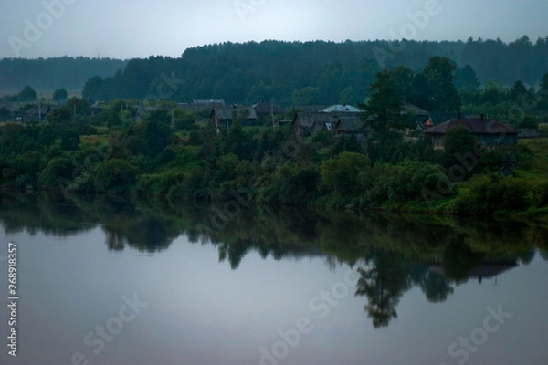 Fototapeta Silence early in the morning in the village on the river
