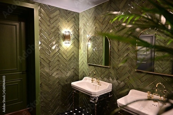 Fototapeta Toilet room with washbasins in a public place. Toilet room with washbasins of green color.