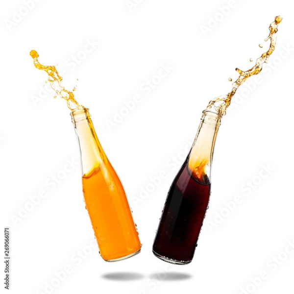 Fototapeta Cola and orange soda splashing out of glass bottle isolated on white background.