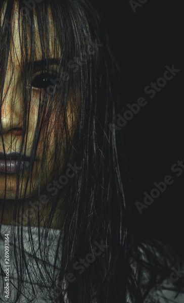 Fototapeta Scary cursed girl with black eyes on dark background copy space