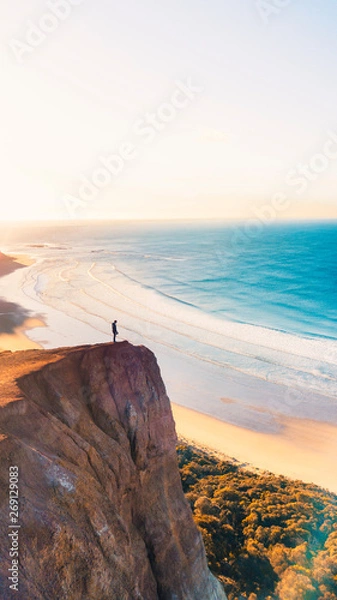 Fototapeta Aerial View of Beautiful Beach Coastline with Person on top of Cliffs Along the Great Ocean Road Australia