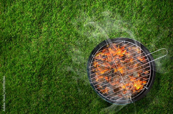 Obraz Burning barbecue on grass background