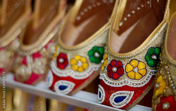 Fototapeta   Closeup Indian woman fashion shoes or  footwear in display outdoors in front of a retail shop                     