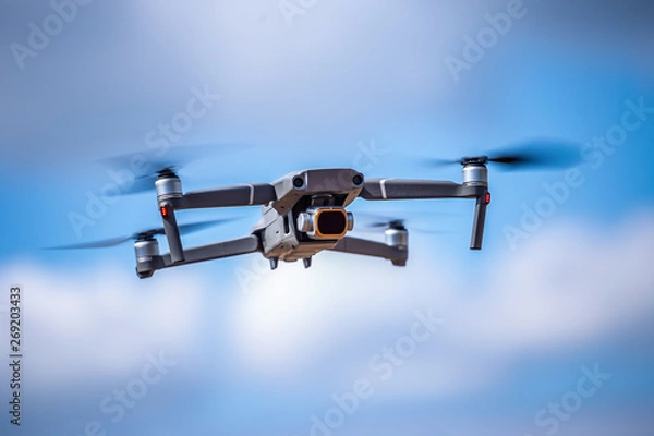 Fototapeta Drone with high resolution digital camera on the sky. Weather is cloudy