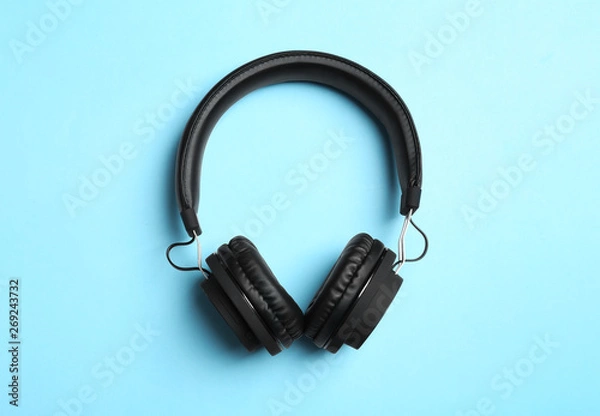 Fototapeta Stylish headphones on color background, top view